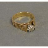 A 9ct. Yellow Gold Solitaire Diamond Ring, set single diamond in a star setting