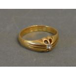 An 18ct. Yellow Gold Solitaire Diamond Gypsy Ring