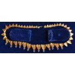 An 18ct. Gold Fringe Necklace Set With Sapphire Clusters within an original lined box, 42.8 gms