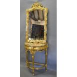 A Carved Gilt Wood Console Table of Demilune Form with a shaped carved mirror above a variegated