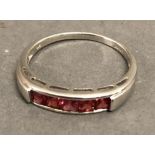 A 9ct. White Gold Band Ring set five Garnets