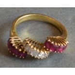 An 18ct. Gold, Ruby and Diamond Ring of Triple Band Fan Form, 4.9 gms all in