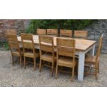 A Large Pine And Painted Refectory Style Dining Table the heavy plank top above square legs, 250