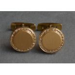A Pair of 18ct. Gold Cufflinks to match the previous lot, each set with diamond border 1.8cms