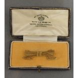A 15 ct. Gold Brooch In The Form Of A Bow Retailed By Mappin & Webb, within fitted box, 4.1 gm