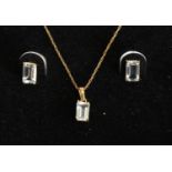 A 10 ct. Gold and Aquamarine Suite of Jewellery, comprising a pendant with chain and a pair of