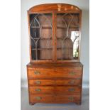 A Regency Mahogany Secretaire Bookcase The Shaped Cornice above a pair of arched glazed doors