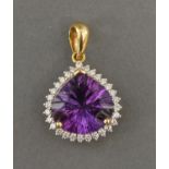 An 18ct. Gold, Amethyst And Diamond Pendant, set with a large Amethyst surrounded by diamonds,