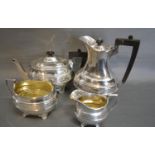 A Sheffield Silver Four Piece Tea Service comprising teapot, hot water pot, two handled sucrier