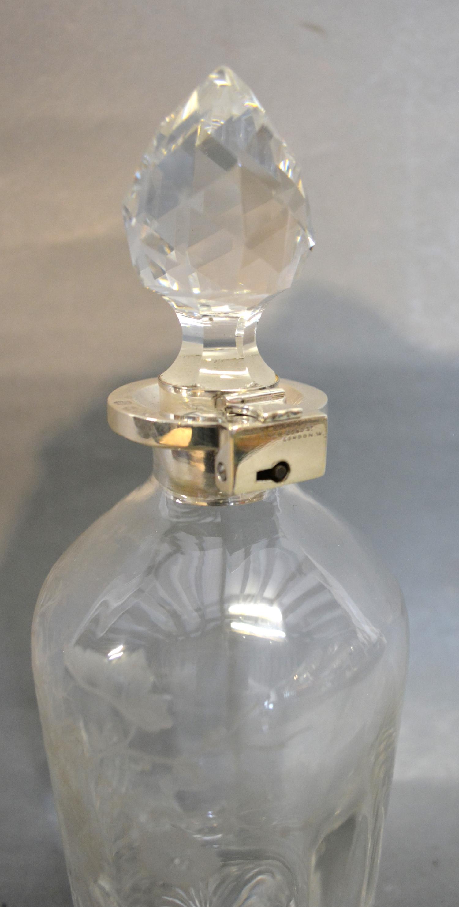 A Victorian Silver Mounted and Cut Glass Decanter with locking mechanism etched with birds amongst - Image 2 of 2