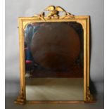 A 19th Century French Gilt Framed Over Mantle Mirror with a carved bird cresting, 115 by 88 cms