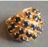 A 9ct. Gold Large Dress Ring Set With Sapphires