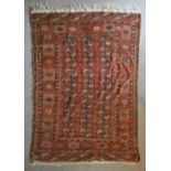 A Bokhara Woollen Rug with Three Rows of Guls within multiple borders 197 by 134 cms