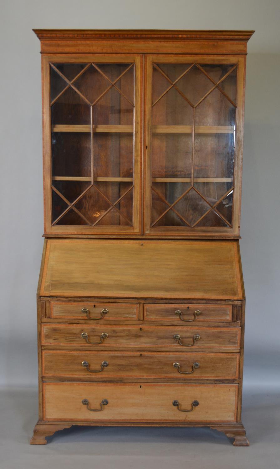 An Edwardian Mahogany Satinwood Inlaid Bureau Bookcase the moulded cornice above two astragal glazed