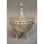 An Edwardian Silver Pot Pourri Of Stylized Form, the pierced cover above Ram's head supports with