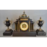 A Victorian Black Slate Three Piece Clock Garniture, the clock with brass Corinthian columns