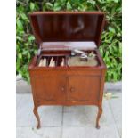 A Pelican Gramophone Within Mahogany Cabinet With Records