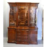 A 20th Century Mahogany Break Front Bookcase The Moulded Cornice above three astragal glazed doors