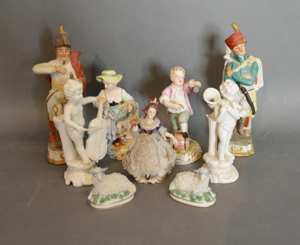 A Pair Of German Porcelain Figures Together With Other Similar Ceramics