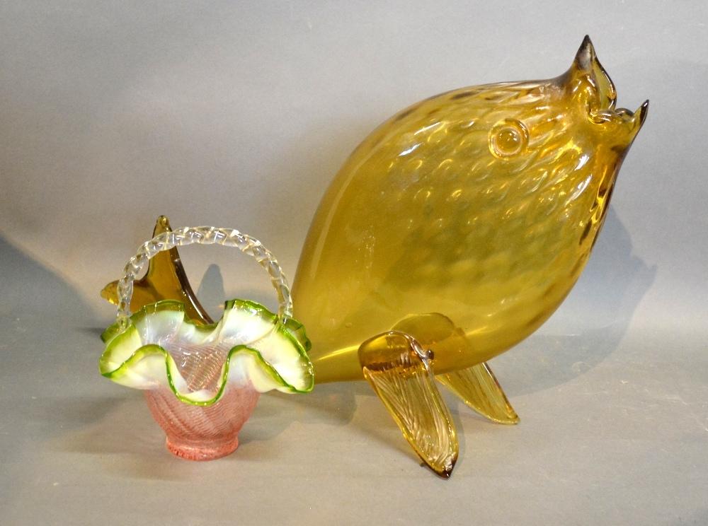 A Merano Large Glass Model Of A Fish, together with a glass shaped basket