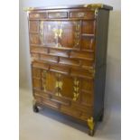 A Chinese Brass Mounted Side Cabinet With An Arrangement Of Drawers And Cupboards, raised upon
