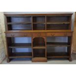 A 19th Century Oak Dwarf Bookcase Matching The Previous Lot, the molded cornice above an arrangement