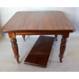 A Late Victorian Walnut Extending Dining Table, the moulded top above a plain frieze raised upon