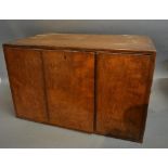 A Victorian Walnut Humidor With Two Doors Enclosing Three Drawers with sunken brass handles and