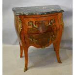 A French Kingwood Marquetry Inlaid and Gilt Metal Mounted Bombe Commode, the variegated marble top