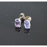 A Pair Of White Gold Tanzanite Ear Studs Of Oval Form Claw Set
