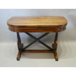 A Regency Rosewood Tea Table A Brass Inlaid Hinge Top above a plain frieze, raised upon twin end