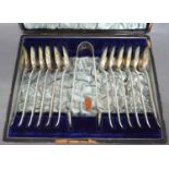 A Set of Twelve Victorian Silver Bead Pattern Teaspoons with matching tongs in fitted lined case,