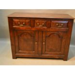 A Reproduction Oak Dresser Base The Moulded Top above three moulded doors and two arch doors flanked