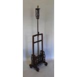 A Chinese Hardwood Adjustable Lamp Standard of pierced scroll form, 147cm high