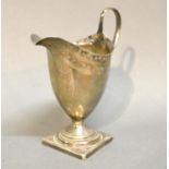 A George III Silver Helmet Shaped Cream Jug, with square pedestal base, London 1791