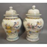 A Pair of Canton Porcelain Covered Vases, decorated in polychrome enamels highlighted with gilt,