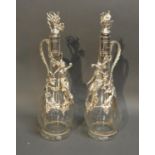 A Pair Of Silver Plated And Glass Decanters Decorated with figure amongst grapevine and with