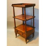 A William IV Mahogany Three Tier What Not With A Shaped Gallery and turned uprights with drawer