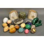 A Collection Of Hand Warmers In The Form Of Eggs, various stones together with various fossils