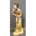 A Japanese Satsuma Porcelain Figure In The Form Of A Lady, decorated in polychrome enamels