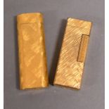 A Cartier Lighter, Together With Another Similar Lighter by Dunhill