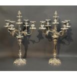 A Pair Of Silver Plated Five Branch Candelabrum, each with grapevine decoration upon a shaped
