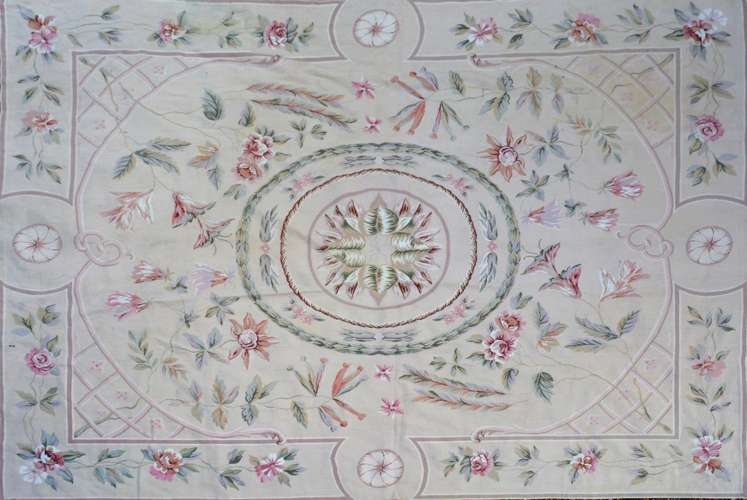 An Aubusson Style Woollen Carpet With An All Over Foliate Design upon a beige ground, 296cm by 240cm