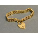 A 9ct. Gold Gate Link Bracelet With Padlock Clasp, 19.9gm