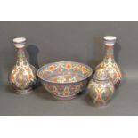 A Kaiser Bowl Together With A Pair Of Matching Bottleneck Vases and a matching covered vase