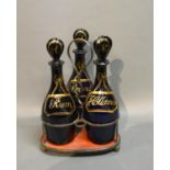 A Set Of Three Regency Blue Glass Decanters With Stoppers, gilded with Rum, Brandy and Hollands