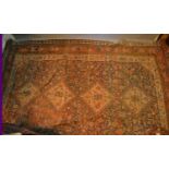 A North West Persian Woollen Carpet With Four Central Medallions within an all over design upon a