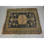 A North West Persian Woollen Rug With A Central Medallion within an all over design upon a blue
