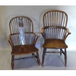 An Early 19th Century Windsor Armchair With A Spindle Back above a shaped panel seat, raised upon