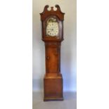 A George III Oak Long Case Clock the arched hood with swan neck pediment above a shaped door and